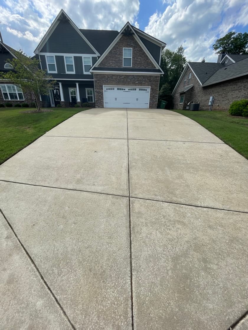 Clean concrete driveway after driveway cleaning by Team Clean in the Columbus GA area